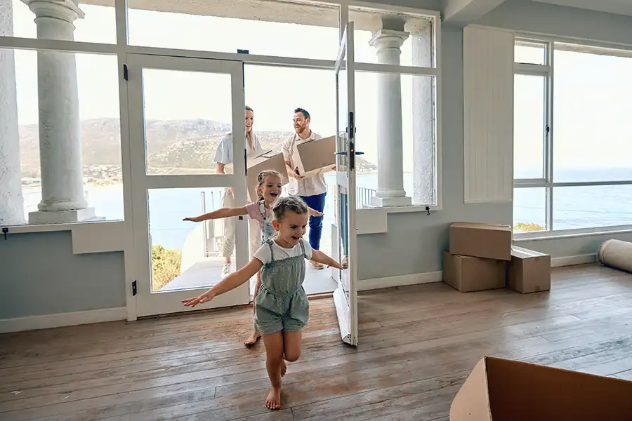 Family entering home or cottage, symbolizing homeowners and tenants insurance.

