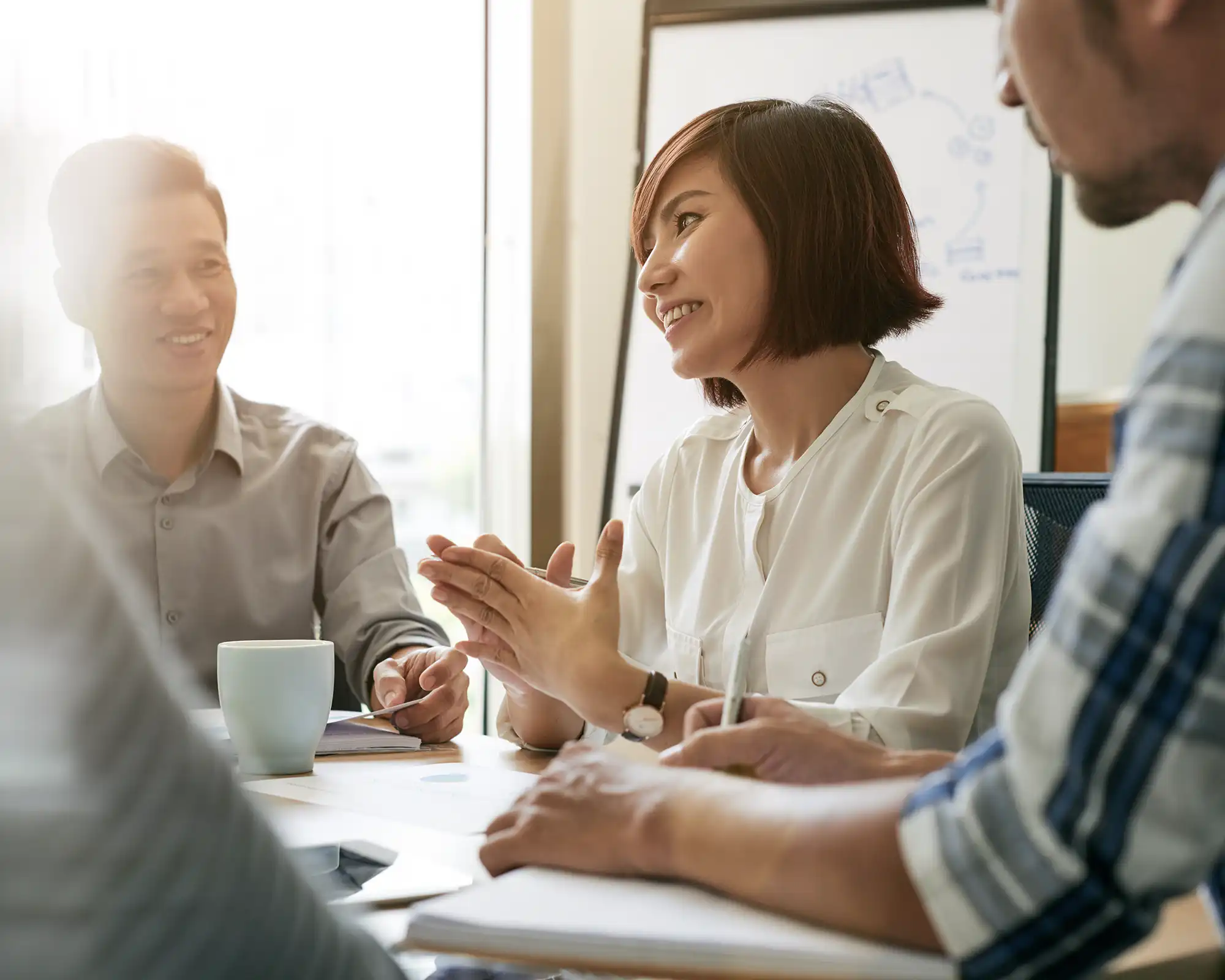 Client and advisor discussing personal insurance needs at a table.
